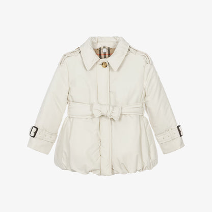 A cream-colored Burberry children's trench coat with a matching waist tie belt, shown against a plain white background.