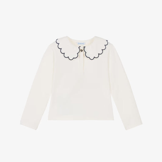 An off-white long-sleeve top for toddlers, featuring a decorative scalloped Peter Pan collar outlined in black and a small embroidered bee at the center, displayed on a clean white background.