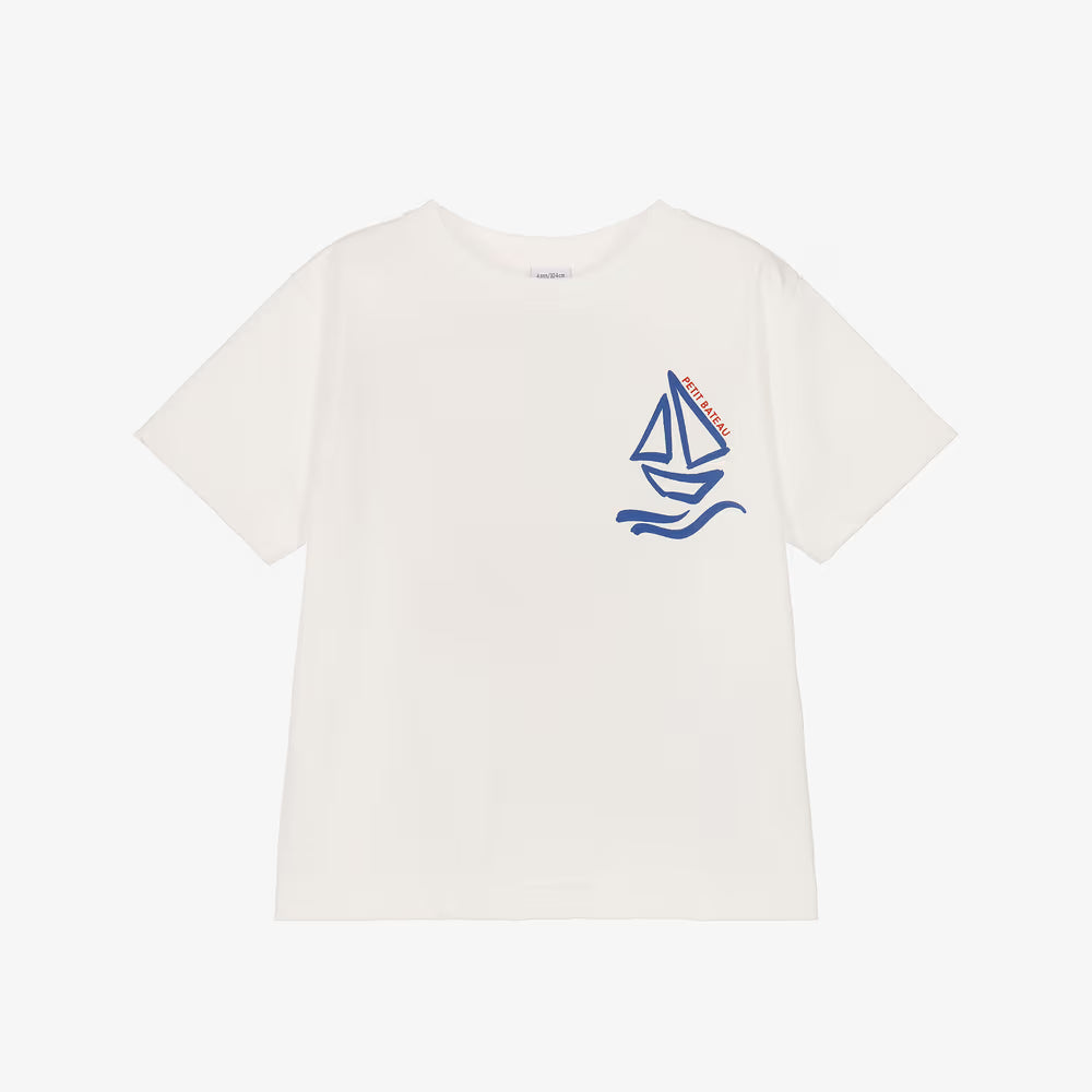 An off-white short-sleeve crewneck t-shirt featuring a blue sailboat graphic on the left chest with the brand name 'SAILOR' printed vertically on the sail.