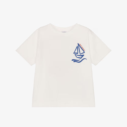 An off-white short-sleeve crewneck t-shirt featuring a blue sailboat graphic on the left chest with the brand name 'SAILOR' printed vertically on the sail.