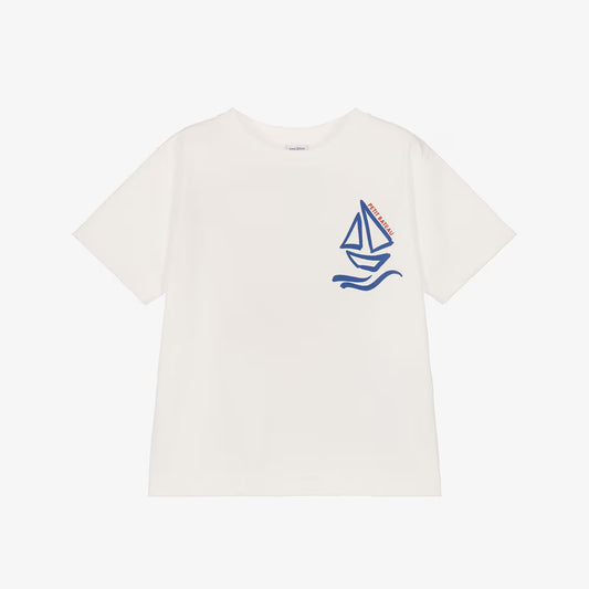 An off-white short-sleeve crewneck t-shirt featuring a blue sailboat graphic on the left chest with the brand name 'SAILOR' printed vertically on the sail.
