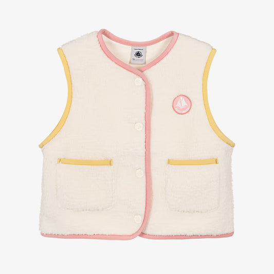 A cream-colored textured fleece vest with pink and yellow trim, featuring a button-up front, two front pockets, and a circular embroidered logo on the left chest.