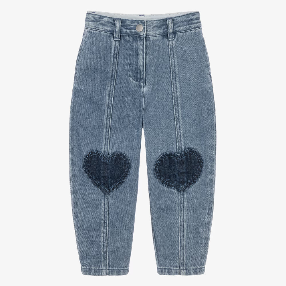 Light blue denim cropped pants with dark blue heart-shaped patchwork details on the front of each leg, shown flat on a light gray background.